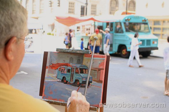 Photo from Raleigh News & Observer showing Doug working on painting 2