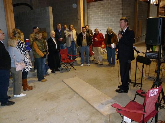 Congressman Etheridge speaking to some of the hikers, bidders, and artists