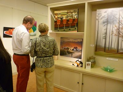 Gallery visitors ponder 2 of Doug's paintings