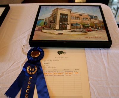 Doug's winning quick painting entry recieves bids during the silent auction.